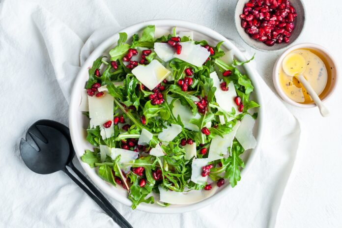 Overhead-rockket-and-pomegranate-salad Jarjeer bi Rumman (Lebanese Arugula and Pomegranate Salad)